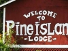 Welcome to Pine Island Lodge Sign